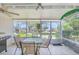 Enclosed porch with outdoor seating and a barbecue grill at 1220 Villa Ln # 135, Apopka, FL 32712