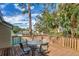 Outdoor balcony with a table and chairs, overlooking green space, perfect for relaxation and enjoying nature at 134 Springwood Cir # A, Longwood, FL 32750