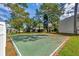 Community basketball court surrounded by well-maintained lawns and mature trees at 134 Springwood Cir # A, Longwood, FL 32750