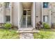 Inviting condo exterior with well-maintained landscaping and easy access stairway at 134 Springwood Cir # A, Longwood, FL 32750