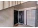 Hallway with unit doors, a secure screen door, and a 'cat' door mat, offering a sense of community at 134 Springwood Cir # A, Longwood, FL 32750