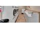 Bright laundry room offers several washers and dryers for communal use at 134 Springwood Cir # A, Longwood, FL 32750