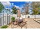 Back patio area that features an umbrella, a table, and multiple chairs at 134 Springwood Cir # A, Longwood, FL 32750