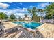 Large community pool with a brick patio, lounge chairs, and a secure fence, ideal for relaxation at 134 Springwood Cir # A, Longwood, FL 32750