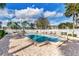 Sparkling community pool surrounded by a spacious patio and lush landscaping at 134 Springwood Cir # A, Longwood, FL 32750