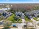 Stunning aerial view of a luxurious home with a well-manicured lawn and beautiful landscaping near the lake at 16315 Bristol Lake Cir, Orlando, FL 32828