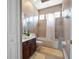 Bathroom featuring tile flooring, a vanity with a sink, and a bathtub with shower at 16315 Bristol Lake Cir, Orlando, FL 32828