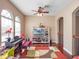 Cozy living room with a piano and arched windows for natural light at 16315 Bristol Lake Cir, Orlando, FL 32828