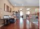 Upstairs living area featuring a bookshelf, hardwood floors, and natural light at 16315 Bristol Lake Cir, Orlando, FL 32828