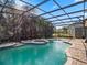 Screened pool area with spa and paved patio at 16315 Bristol Lake Cir, Orlando, FL 32828