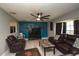 Gathering room featuring bright accent wall, modern ceiling fan, and tiled floor at 1659 Nantucket St, Deltona, FL 32725