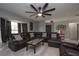 Inviting living room with a large sofa, statement ceiling fan, and great natural light at 1659 Nantucket St, Deltona, FL 32725