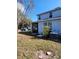 Backyard view, including an air conditioning unit and the partially screened in lanai at 1820 Shumard Ave, St Cloud, FL 34771