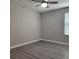 Cozy bedroom featuring a ceiling fan and natural light from a window with blinds at 1820 Shumard Ave, St Cloud, FL 34771