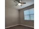 Cozy bedroom featuring a ceiling fan, laminate flooring, and a window providing natural light at 1820 Shumard Ave, St Cloud, FL 34771