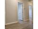 The hallway includes gray walls and wood-look flooring at 1820 Shumard Ave, St Cloud, FL 34771