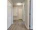 The hallway includes gray walls and wood-look flooring at 1820 Shumard Ave, St Cloud, FL 34771