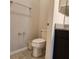 A standard toilet sits adjacent to the vanity in the bathroom area at 1820 Shumard Ave, St Cloud, FL 34771