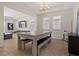 Bright dining area features a modern table with benches and a stylish chandelier at 1942 Rankin St, Kissimmee, FL 34744