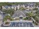 Aerial view of community with clubhouse and parking at 2015 Erving Cir # 106, Ocoee, FL 34761