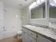 Clean bathroom with white vanity and bathtub at 2015 Erving Cir # 106, Ocoee, FL 34761