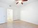 Bedroom with tile floors, ceiling fan and access to bathroom at 2015 Erving Cir # 106, Ocoee, FL 34761