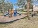 Community playground with slides and climbing structures at 2015 Erving Cir # 106, Ocoee, FL 34761