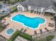 Community pool with jacuzzi and plenty of lounge chairs at 2015 Erving Cir # 106, Ocoee, FL 34761