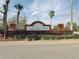 Lake Jackson Ridge entrance sign featuring brick columns, a manicured hedge, and vibrant Florida palms at 2401 Begonia St, Mascotte, FL 34753