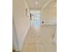 Inviting foyer with neutral tile flooring and a seamless flow into the living spaces at 2401 Begonia St, Mascotte, FL 34753