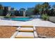 Exterior shot of a clean community pool surrounded by trees and a patio at 243 Scottsdale Sq # 243, Winter Park, FL 32792