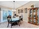 Dining room with a chandelier and sliding door leading to a patio at 2488 Cherokee Ct, The Villages, FL 32162