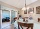 Dining area featuring a table with seating for four and sliding glass doors to a patio at 2488 Cherokee Ct, The Villages, FL 32162