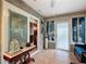 Relaxing sunroom with tile flooring, decorative console table, and plenty of natural light at 2488 Cherokee Ct, The Villages, FL 32162