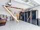 Tidy garage featuring epoxy flooring, built-in cabinets, and a pull-down ladder for storage at 2488 Cherokee Ct, The Villages, FL 32162