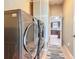 Well-organized laundry room featuring an LG washer and dryer set and a view into the kitchen at 2488 Cherokee Ct, The Villages, FL 32162