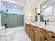 Well-lit bathroom with a double sink vanity and tiled shower at 2520 Chanute Trl, Maitland, FL 32751