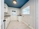 Charming laundry room with white cabinets and a sink at 2520 Chanute Trl, Maitland, FL 32751