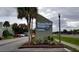 Winter Park Woods Condominium signage, landscaping, with nearby parking and greenery at 285 Scottsdale Sq # 285, Winter Park, FL 32792