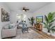 Comfortable living room area featuring natural lighting and stylish decor at 329 Streamview Way, Winter Springs, FL 32708