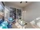 Comfortable seating area on the lanai overlooking the interior of the home, featuring tile floors at 329 Streamview Way, Winter Springs, FL 32708