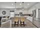 Modern kitchen featuring stainless steel appliances, a center island, and an open floor plan at 3563 Fernanda Dr, Deltona, FL 32738