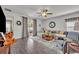 Bright living room with hardwood floors, neutral color palette, and sliding glass doors to the outside at 3563 Fernanda Dr, Deltona, FL 32738