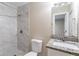 Updated bathroom with tiled shower, granite vanity, and modern fixtures at 4108 Westgate Rd, Orlando, FL 32808