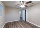 Bedroom featuring new flooring, neutral paint, and modern ceiling fan at 4108 Westgate Rd, Orlando, FL 32808