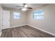 Bedroom with new flooring, baseboards, and two windows for natural light at 4108 Westgate Rd, Orlando, FL 32808