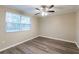 This bedroom features a window and a modern ceiling fan at 4108 Westgate Rd, Orlando, FL 32808