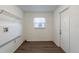 This is a laundry room with a window and storage shelves at 4108 Westgate Rd, Orlando, FL 32808