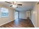 Bright living room with new floors, ceiling fan and sliding glass doors at 4108 Westgate Rd, Orlando, FL 32808