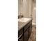 Bathroom with granite vanity, single sink, and updated fixtures at 411 Caribbean Ct, Kissimmee, FL 34759